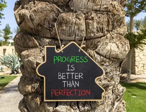 Progress or perfection words symbol. Concept words Progress is better than .. Stockfoto's