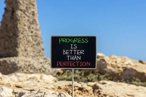 Progress or perfection words symbol. Concept words Progress is better than .. Stockfoto's