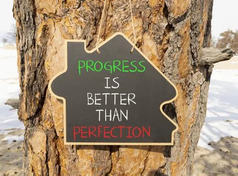 Progress or perfection words symbol. Concept words Progress is better than .. Stockfoto's