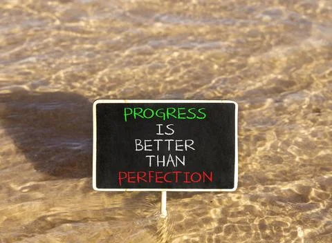 Progress or perfection words symbol. Concept words Progress is better than .. Stockfoto's