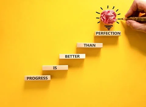 Progress or perfection words symbol. Concept words Progress is better than .. Stock Photos