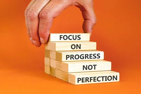 Progress or perfection words symbol. Concept words Focus on progress not pe.. Stockfoto's