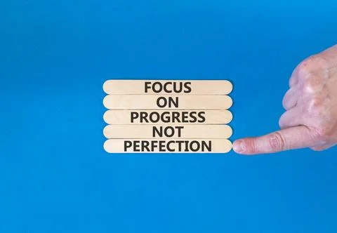 Progress or perfection words symbol. Concept words Focus on progress not pe.. Stock Photos
