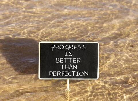 Progress or perfection words symbol. Concept words Progress is better than .. Stock Photos