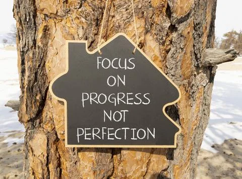 Progress or perfection words symbol. Concept words Focus on progress not pe.. Stock Photos
