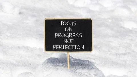Progress or perfection words symbol. Concept words Focus on progress not pe.. Stock Photos