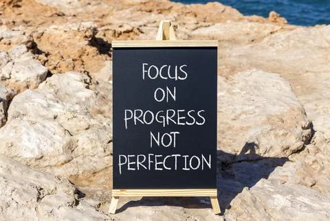 Progress or perfection words symbol. Concept words Focus on progress not pe.. Stock Photos