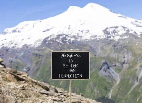 Progress or perfection words symbol. Concept words Progress is better than .. Stock Photos