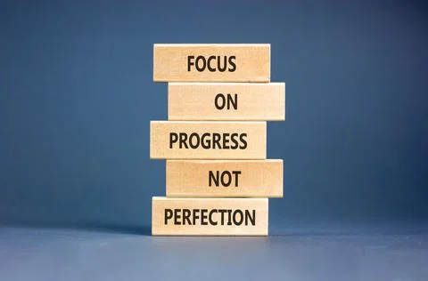 Progress or perfection words symbol. Concept words Focus on progress not pe.. Stock Photos