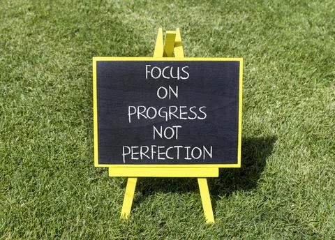 Progress or perfection words symbol. Concept words Focus on progress not pe.. Stock Photos