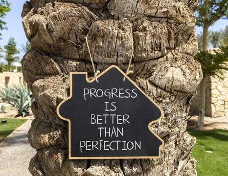 Progress or perfection words symbol. Concept words Progress is better than .. Stock Photos