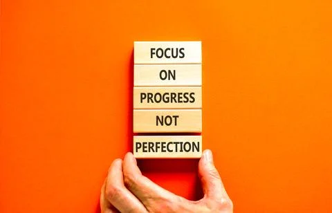 Progress or perfection words symbol. Concept words Focus on progress not pe.. Stock Photos