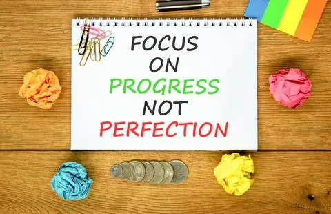 Progress or perfection words symbol. Concept words Focus on progress not pe.. Stock Photos
