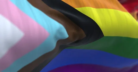 Progress Pride flag close-up with LGBTQIA+ inclusive colors and symbol of uni Stock Footage 305753838
