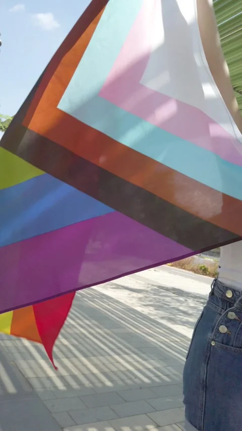 Progress pride flag. Lesbian Girl Holding LGBT Flag. Stock Footage 211652250