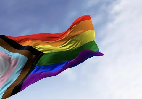 Progress Pride Flag waving against cloudy blue sky Stock Illustration
