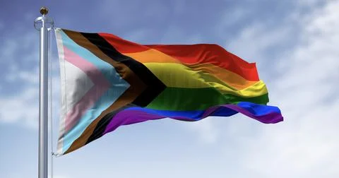 Progress Pride Flag Waving on Flagpole Against Blue Sky Stock Illustration