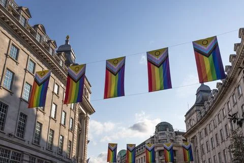 Progress pride flags hanging on Regent Street in London Фото