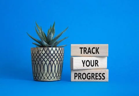 Progress symbol. Wooden blocks with words Track Your Progress. Beautiful bl.. 스톡 사진