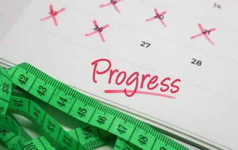 Progress text on calendar with measuring tape. Concept of health tracking, .. Stock Photos
