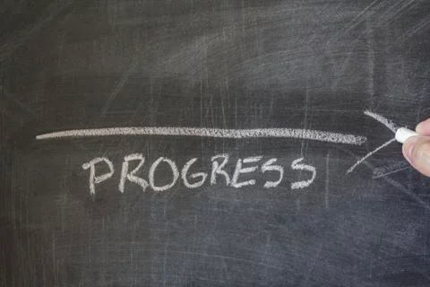 Progress written on blackboard Stock Photos