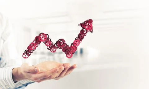 Progressing graph presented in male palms as symbol of success a Stock Photos