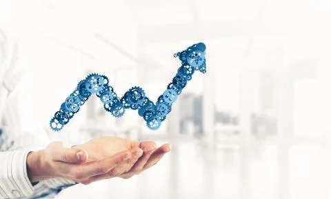 Progressing graph presented in male palms as symbol of success a Stock Photos