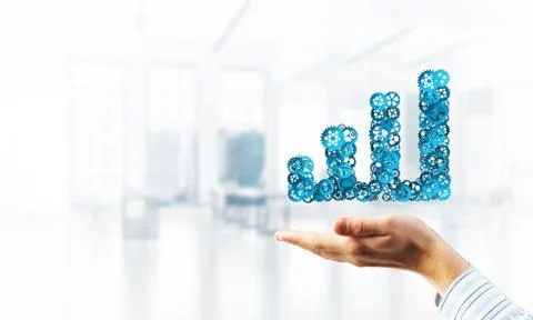 Progressing graph presented in male palms as symbol of success and improvement Stock Photos