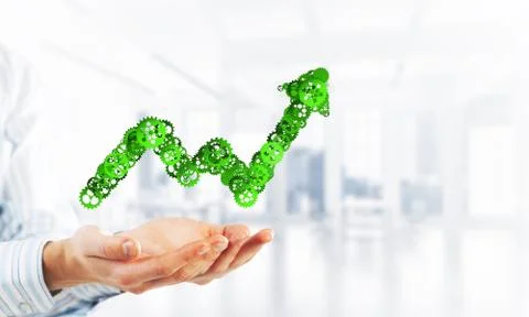 Progressing graph presented in male palms as symbol of success and improvement Stock Photos