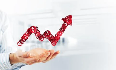Progressing graph presented in male palms as symbol of success and improvement Stock Photos