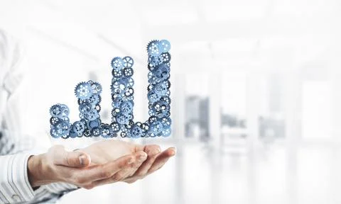 Progressing graph presented in male palms as symbol of success a Stock Photos