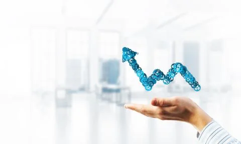 Progressing graph presented in male palms as symbol of success and improvement Stock Photos