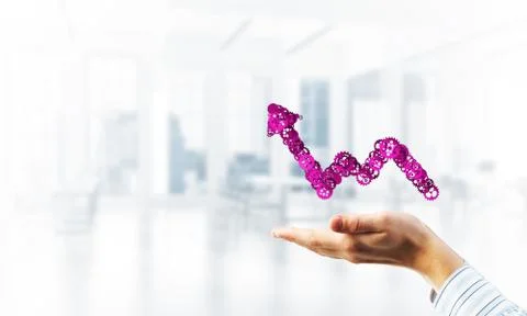 Progressing graph presented in male palms as symbol of success and improvement Stock Photos
