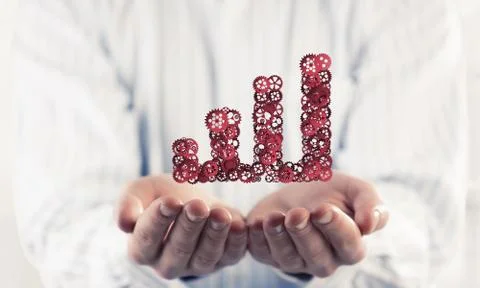 Progressing graph presented in male palms as symbol of success a Stock Photos
