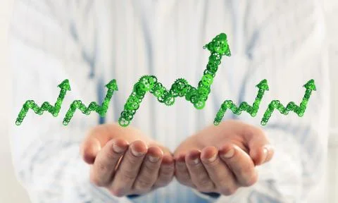 Progressing graph presented in male palms as symbol of success a Stock Photos