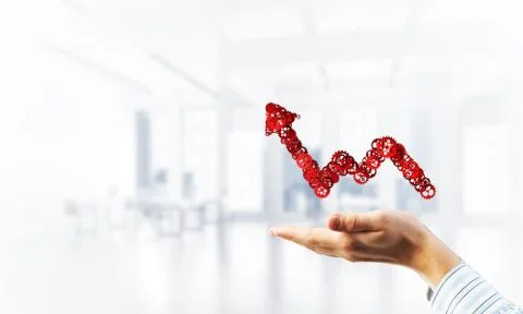 Progressing graph presented in male palms as symbol of success and improvement Stock Photos