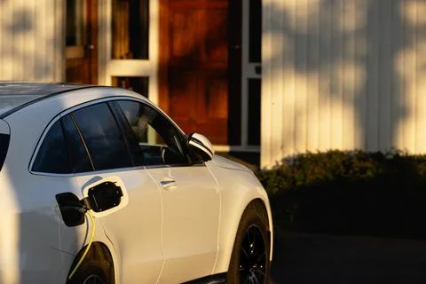 Progressive concept of EV car and home charging station Stock Photos