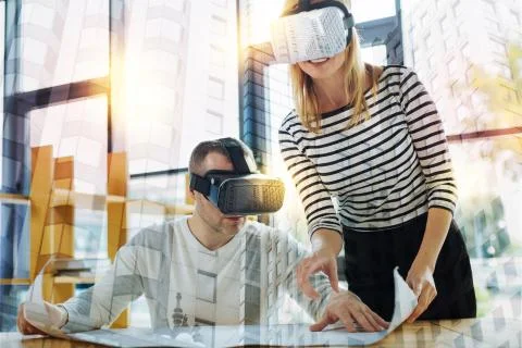 Progressive designers working with a drawing in virtual reality Foto stock
