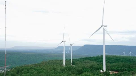 Progressive idea of using wind for electric energy by wind turbine farm. Stock Photos