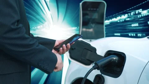 Progressive man check EV car status on smartphone, background of binary code. Stock Footage 230947553