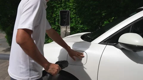 Progressive man install cable plug to hi... | Stock Video | Pond5