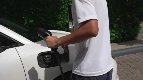Progressive man install cable plug to hi... | Stock Video | Pond5