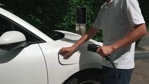 Progressive man install cable plug to hi... | Stock Video | Pond5