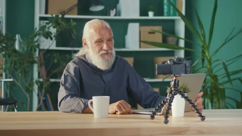 Progressive Older Vlogger Man Recording on Camera New Video Vlog Stock Footage 196250307