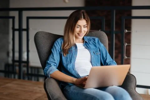 Progressive young woman working remotely from home Stock Photos
