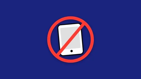 Prohibition sign with a smartphone device on a blue background. Stock Footage 333373881