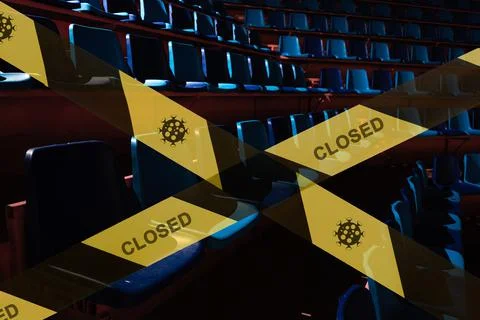 Prohibitive tape on the background of a  empty plastic seats in a sports stad Stock Photos