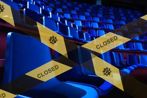 Prohibitive tape on the background of a  empty plastic seats in a sports stad Stock Photos