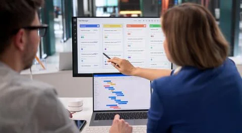 Project Coordinator Diligently Revises Event Timeline With Scrum Tool On Desk Stock Photos