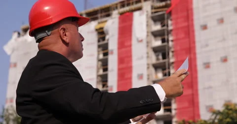 Project Engineer Check Building Plan Drawn by Architect Verify Paper Document Stock-Footage 66904394